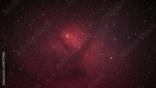 Stars Fill the Night Sky With a Deep Red Hue in a Quiet Location Away From Ci...