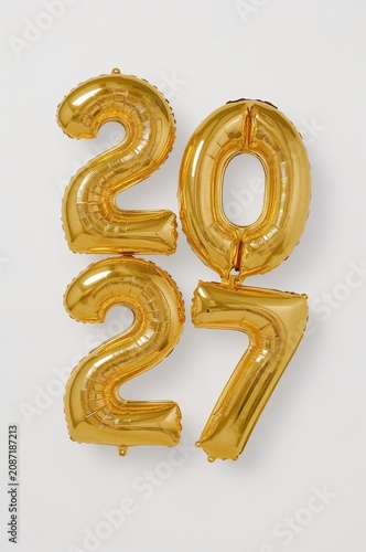 Golden Balloons Show the Numbers Two Zero Two Seven on a Plain Background for...