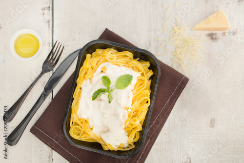 Bild auf Leinwand Close-Up of Pasta in Creamy White Sauce