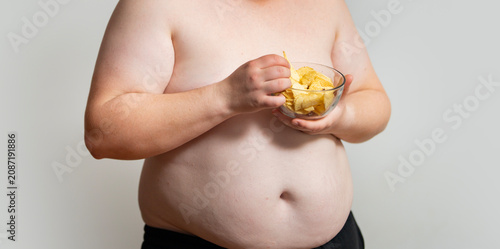 Fotografie Belly fat shows poor nutrition