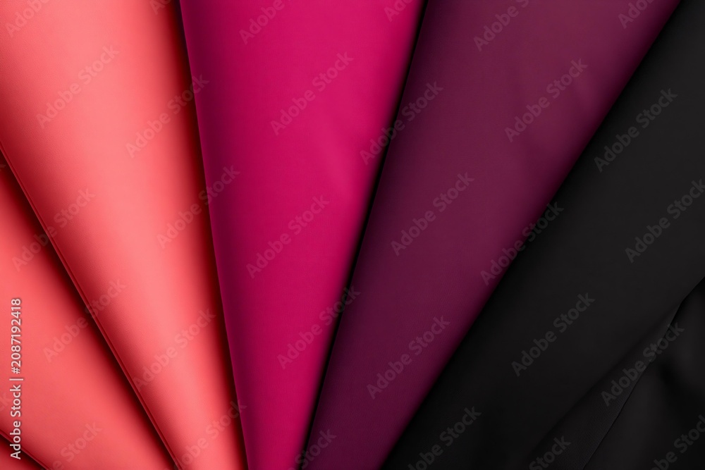 Obraz premium Fabric swatches in fanned arrangement, abstract background