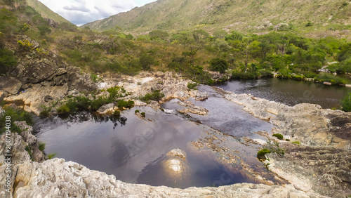 Crystal-clear waterfalls flow through the rugged mountains of the Espinhaço Range, revealing the natural beauty of Minas Gerais, Brazil.