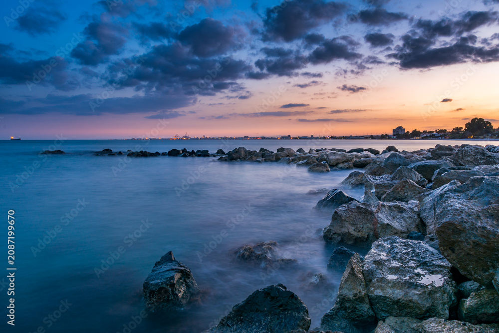 Fototapeta premium Blue Hour Sunset over Rocky Mediterranean Coastline, Limassol, Cyprus