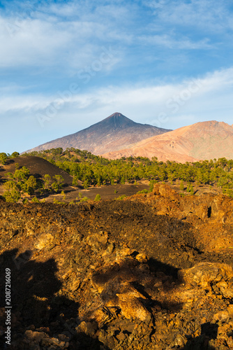 Majestic Mount Teide volcano towering over a rugged volcanic landscape in Tenerife