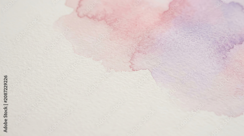 Fototapeta premium Soft pastel watercolor wash blending pink and purple hues on textured white paper background