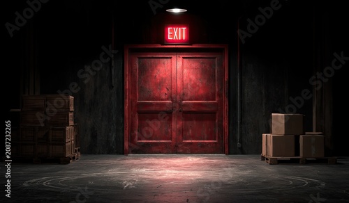 Red double doors with glowing EXIT sign above in dark room
