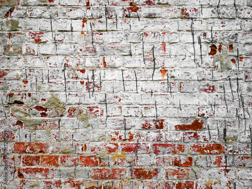 Photos Red abandoned brick wall with paint drips