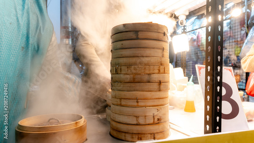 Steaming Shanghai dumplings at Fengjia Night Market