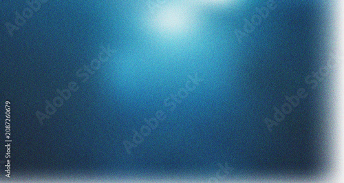 Cuadro en lienzo Deep blue abstract scene with bright glowing light emanating from the top for my