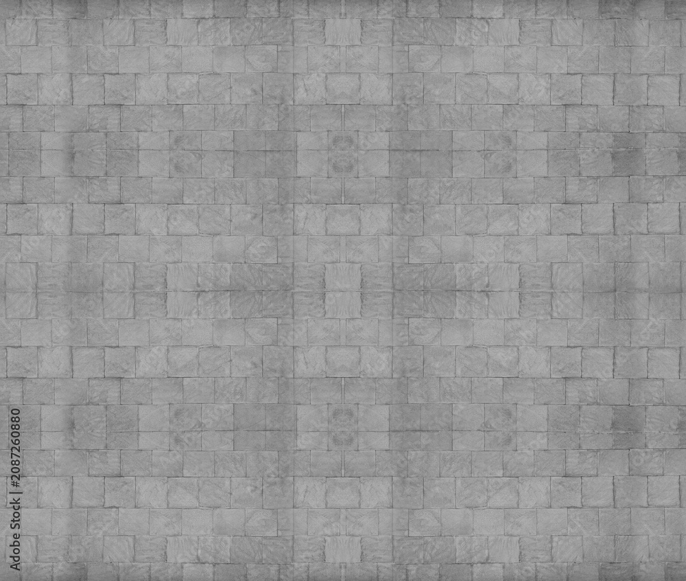 Fototapeta premium Front view of a wall made of gray slabs. background of a new and modern wall or building exterior grey slabs Marble brick pattern floor abstract natural marble black gray wall Top view and front view