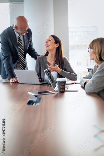 Business colleagues discussing ideas in modern office
