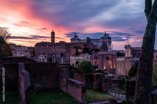 Tableau sur toile Ancient Roman ruins and classical columns at sunset with dramatic purple and pin