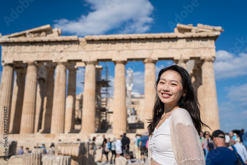 Smiling tourist at the Parthenon in Athens, Greece