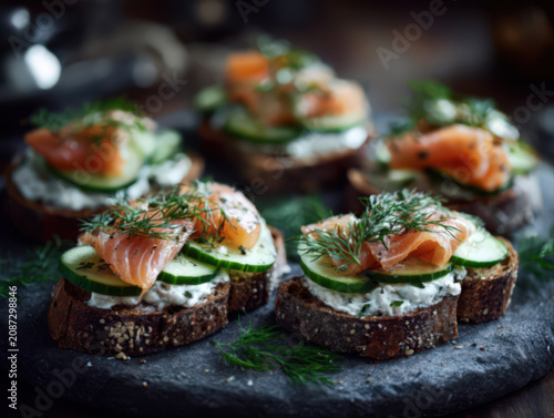 Rustic smoked salmon and cucumber crostini with herbed cream cheese, garnished with fresh dill, served on crusty artisan bread slices