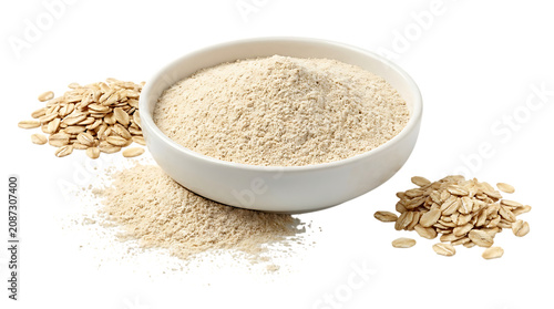 Raw oatmeal flakes in a small ceramic bowl