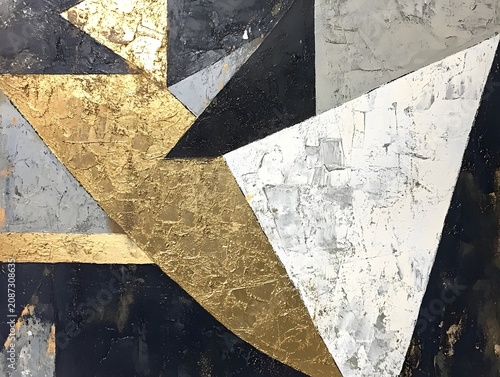 Textured abstract background featuring geometric gold, black, and white triangles.