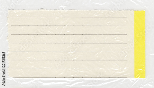 Plastic texture layer covering a lined index card with a yellow border creates a realistic crinkled overlay for alternative grunge typographic templates and retro album artwork