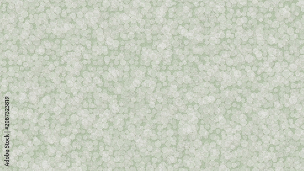 Fototapeta premium A close up view of a light green background with white bokeh.