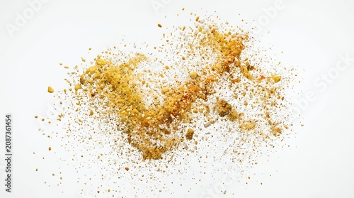 Dynamic Explosion of Yellow Seasoning Powder and Spice Particles Isolated on a White Background for Culinary Design