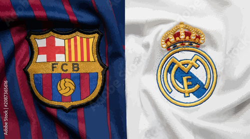 Photography FC Barcelona and Real Madrid logos on fabric close-up - football club crests emb