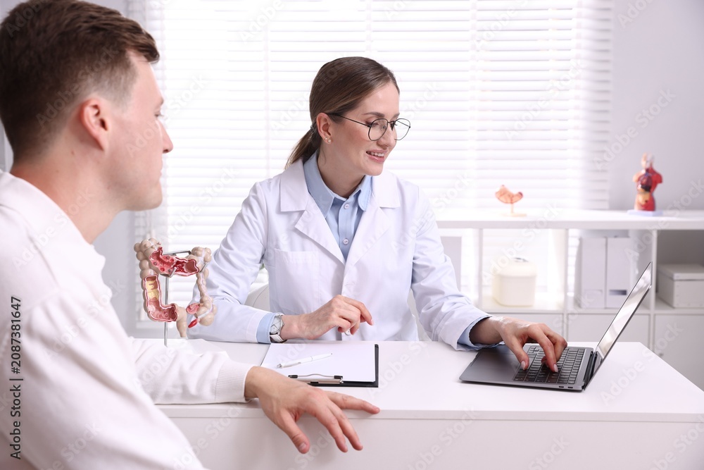 Fototapeta premium Man having appointment with gastroenterologist in clinic