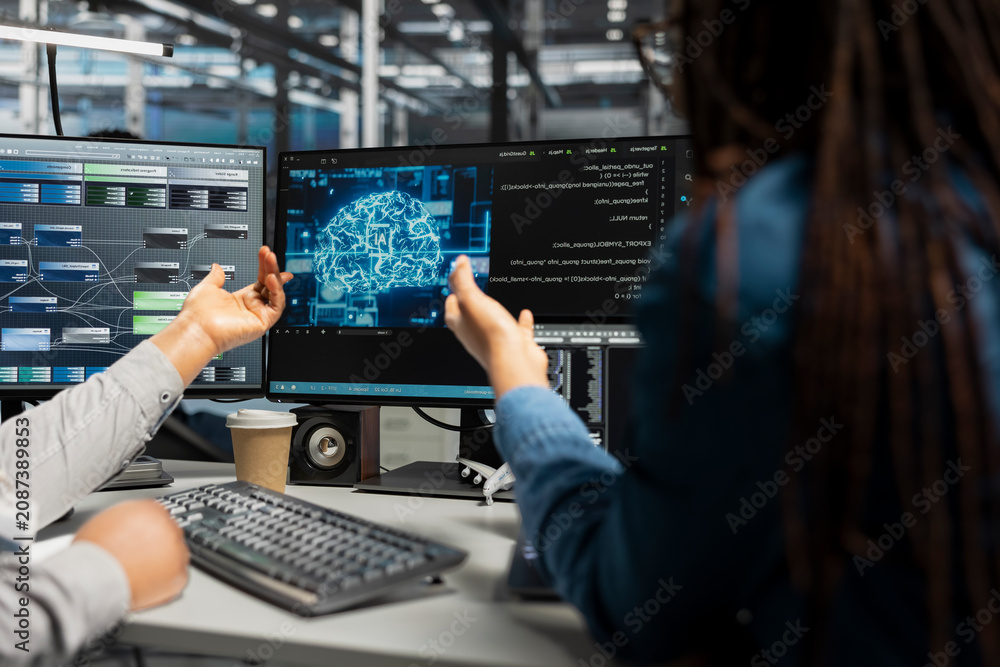 Fototapeta premium Server facility systems engineer and colleague work with AI neural network models technology.