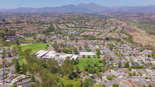 Mission Viejo, California Lateral Aerial of Homes, Traffic and Rolling Hills 02