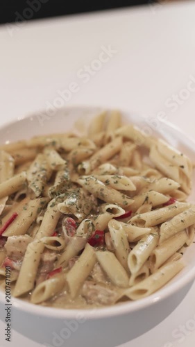 Creamy spiced chicken penne pasta close-up