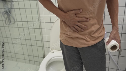 Constipation and diarrhea in bathroom. Hurt man touch belly  stomach ache painful. colon inflammation problem, toxic food, abdominal pain, abdomen, constipated in toilet, stomachache, Hygiene