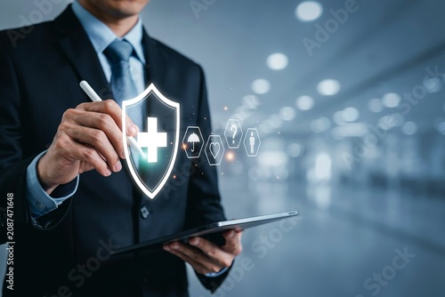 Business Professional Using Digital Tablet With Health Insurance Protection Concept And Medical Shield Icon