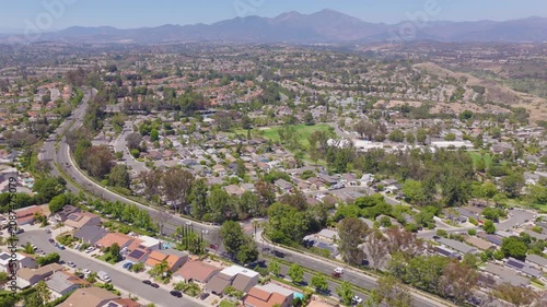 Mission Viejo, California Pullback Aerial of Homes, Golf Course and Mountains