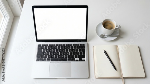 Clean Workspace with Laptop Coffee Cup and Notebook