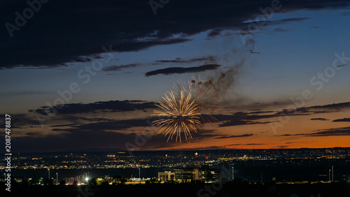 Fireworks over the Rio Grande Valley for the 250th birthday of the USA near Albuquerque New Mexico at sunset