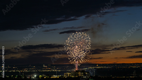Fireworks over the Rio Grande Valley for the 250th birthday of the USA near Albuquerque New Mexico at sunset