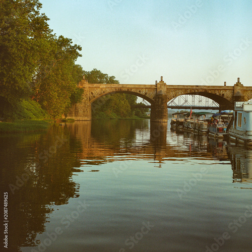 Bridge over a calm river captured on medium format film