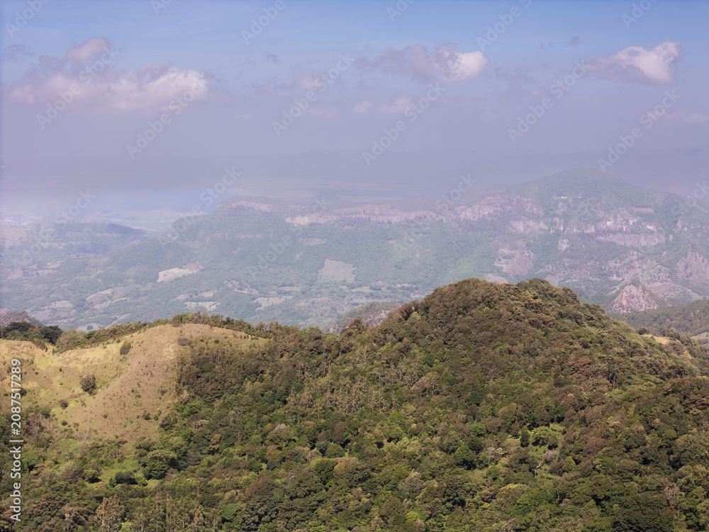 Naklejka premium View of mountains and hills in a rural area during daytime