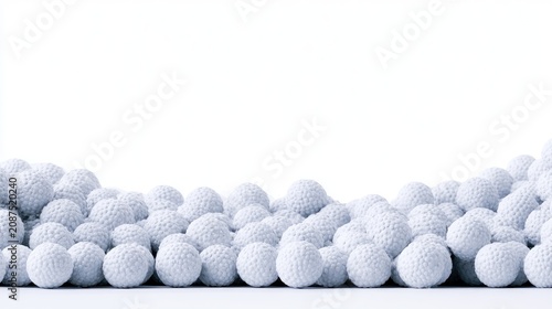 A close-up of a textured, white, spherical objects piled against a white background