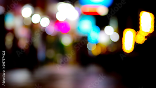 Fotografie Colorful bokeh night street lights creating abstract bokeh background