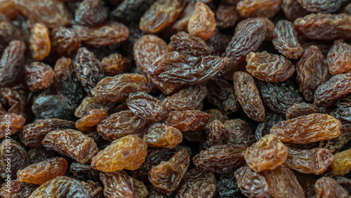 Dried grapes in full screen .Full screen of raisins. Background image.