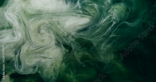 Vapor mix. Watercolor explosion. White green mist spray storm wave ink stream on black abstract background. Glitter blur art texture.