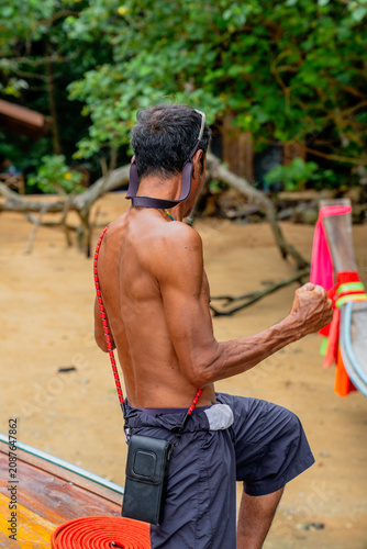 Photography Beach local boatman preparing longtail boat for journey