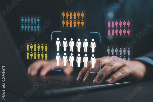 Target market or audience. Marketing segmentation strategy and analysis. Marketer using laptop computer to research customer data.