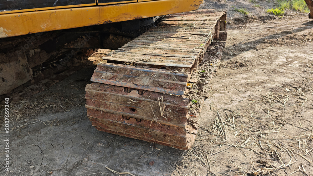 Fototapeta premium Excavator engines. Excavator undercarriage parts. Backhoe.