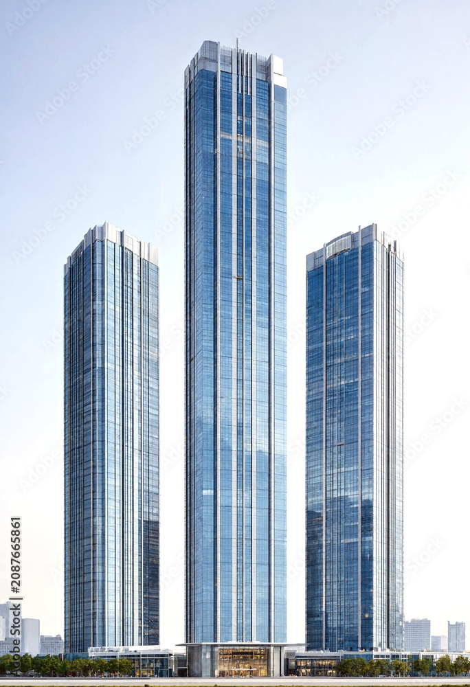 Fototapeta premium Modern glass skyscrapers standing tall in a bustling urban skyline with sleek architectural design and reflections