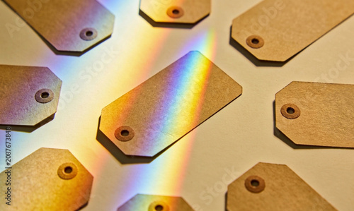 A speculum of light that shines above the brown empty tags placed on the floor