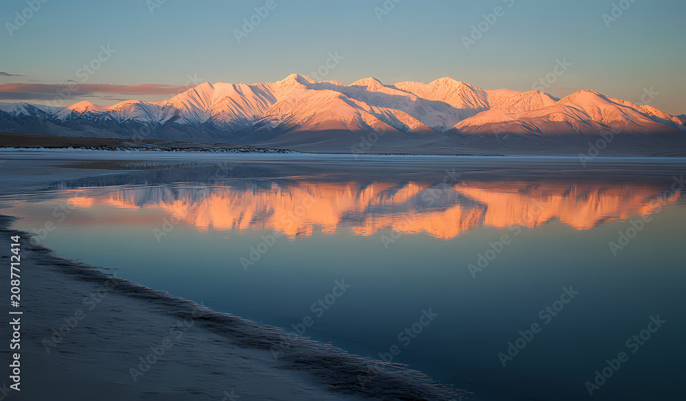 Fototapeta premium Winter Sunrise Reflection on a Frozen Lake