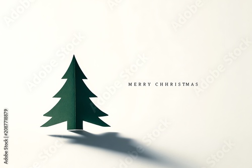 Minimalist Christmas Tree Silhouette with Merry Christmas Text.