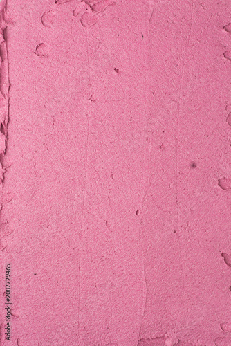 Top view of pink buttercream for decorating cake, textured american buttercream with patterns, overhead view of grainy pink buttercream, cream textured background