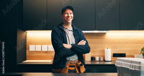 Tableau sur toile Handyman, tools and portrait of man in kitchen for plumbing service, maintenance and repair
