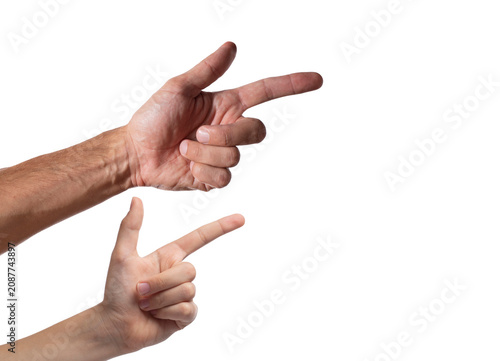 Hands pointing at something, white background. Child hand and adult male hand pointing fingers